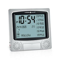 Al-Harameen Azan Clock HA-4010 displaying digital time, prayer times, date, and temperature. The clock includes speakers for the Azan and a built-in Qibla compass.