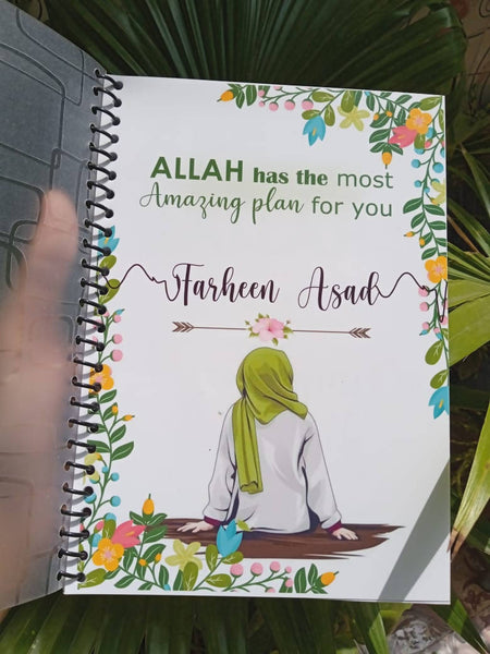 Green Hijabi Customized Notebook with personalized name and designs, featuring full-colored A5 pages, spiral binding, soft transparent cover, and a free non-tearable bookmark. Ideal for gifting or personal use.