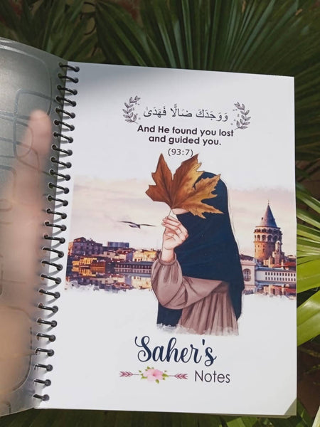 Personalized notebook featuring a colorful illustration of a Hijabi girl on the cover, with an option to add a custom name. This unique Islamic-themed notebook is perfect for school, journaling, or as a thoughtful gift for Muslim girls. The design is vibrant and charming, capturing a sense of cultural pride and creativity.